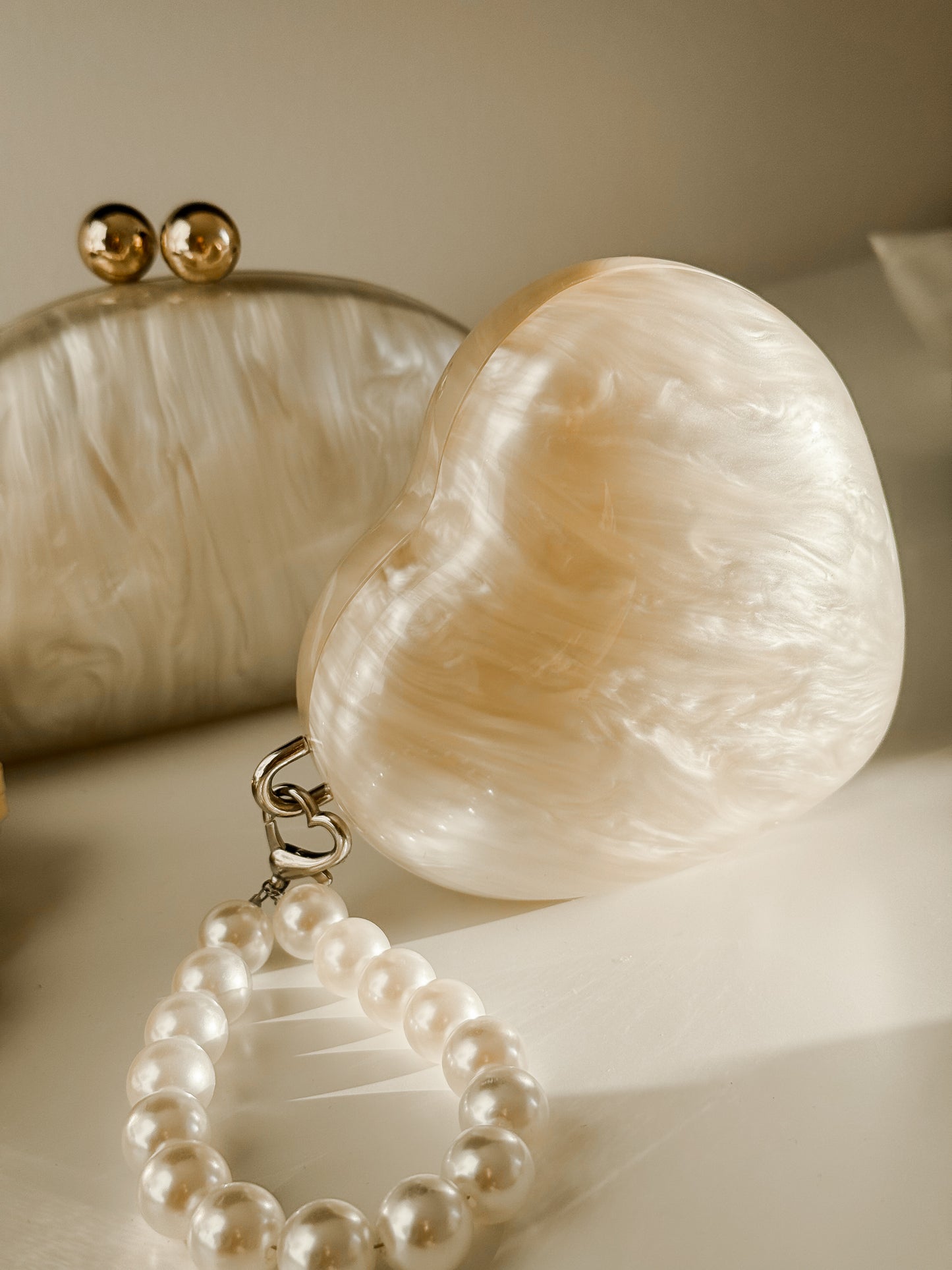 Heart pearl clutch bag